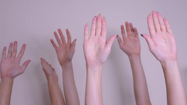 people democracy vote teamwork concept. crowd of people raised their hands up expressing agreement and support. Volunteering lifestyle or voting a teamwork