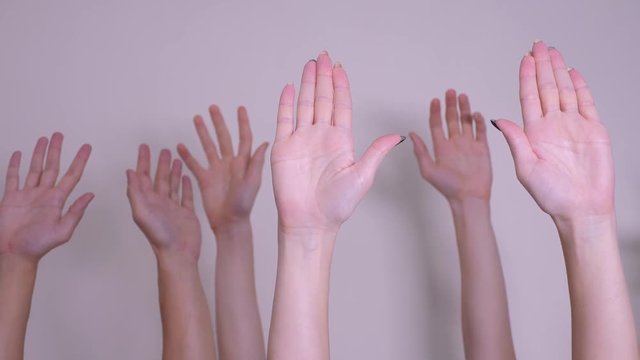 people democracy vote teamwork concept. crowd of people raised their hands up lifestyle expressing agreement and support. Volunteering or voting a teamwork