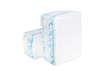 Two stacks of adult diapers isolated on white background. Health care for people with urinary incontinence