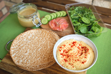 Healthy wraps with salmon and chickpeas for lunch. Love for a healthy food concept