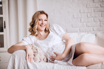 close up. young pregnant woman lying on couch