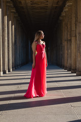 young woman in pink long dress