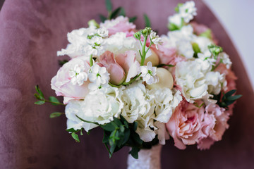 Wedding flowers, bridal bouquet closeup. Decoration made of roses, peonies and decorative plants, close-up, selective focus, nobody, objects