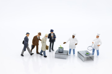 Miniature people : Chefs are preparing food for sale. Image use for  food and beverage, business concept.