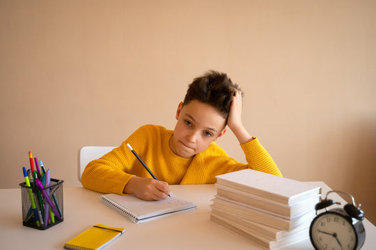 Thinking Child Bored, Frustrated And Fed Up Doing His Homework