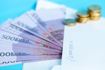 white envelope and cash on the table