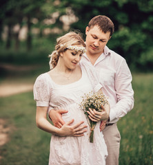 portrait of a cute married couple on a Park background.