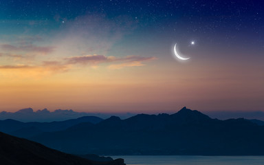 Ramadan Kareem background with crescent and stars © IgorZh