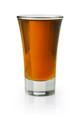 Brown spirit shooter in a shot glass on white background