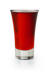 Red shooter in a shot glass on white background