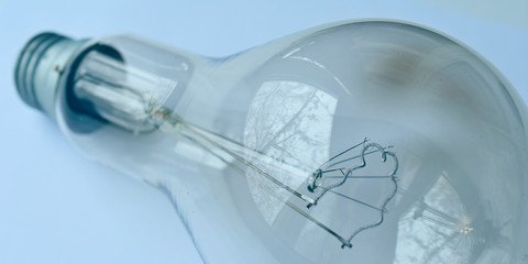 Fototapeta na wymiar incandescent lamp with transparent glass, macro