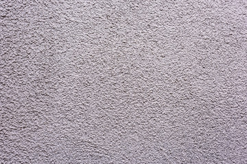 Eine graue Fassade Mauer mit Struktur als Hintergrund