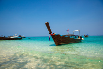 Fototapeta na wymiar Traditional longtail boat on the tropical beach near Koh Phi Phi Island, Thailand
