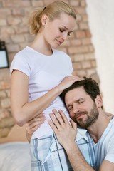 Fototapeta premium Loving couple expecting a baby