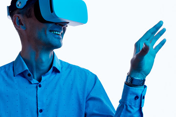 Smiling guy exploring virtual reality