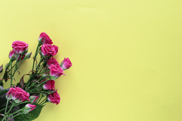 small wedding roses bouquet on yellow background