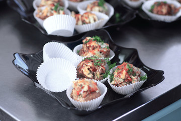 close up.meat muffins in forms on the table