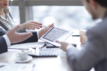 group of business people talking at the table