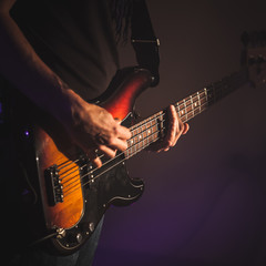 Electric bass guitar player hands, - obrazy, fototapety, plakaty