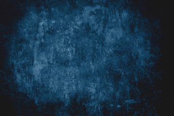 dark blue grungy wall background or texture