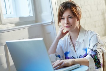 Attractive woman using laptop
