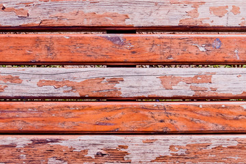 old wooden bench with peeling paint