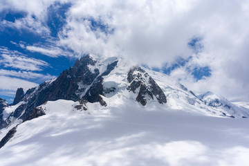 Fototapeta na wymiar Mont Blanc massif under the clouds. Alps.