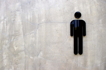Men's Bathroom icon sign (Restroom or Toilet room) on the concrete wall