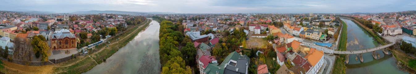 Autumn city panorama of Uzhgorod from a height in the river Uzh, Ukraine