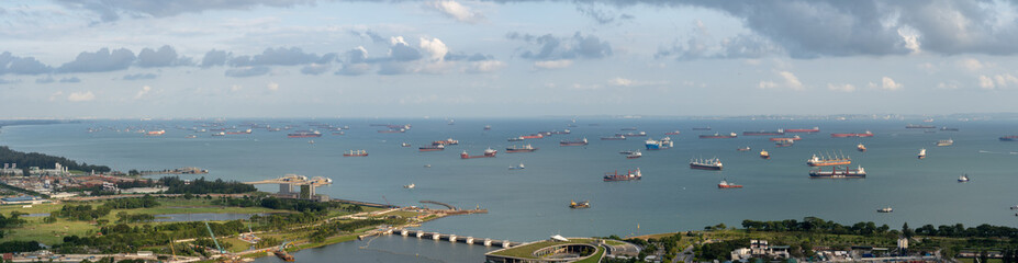 Fototapeta na wymiar Singapore anchorage area panorama opposite Gardens by the Bay with many ships on an anchorage