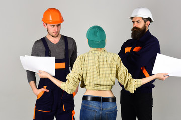 Building your visions. Group of constructing engineers and architects at work. Construction workers...