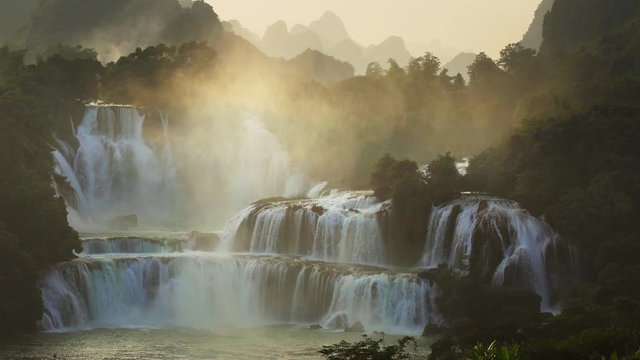 Sunset Bangioc waterfall in Vietnam and Detian waterfall in China, located near border, people can see this waterfall both of country. , tilt up.