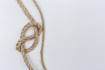 Figure-eight knot or Flemish knot on light rope. Copy space.
