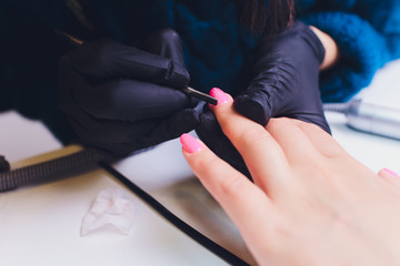 Close up of process france manicure at beauty salon.