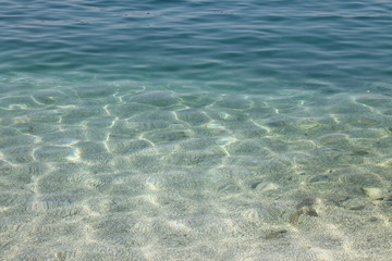 White pebbles on the bottom of the Adriatic sea in Croatia