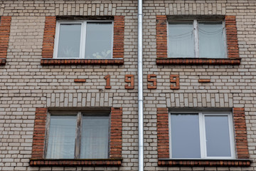 facade of a old russian Khrushchev- era brick house