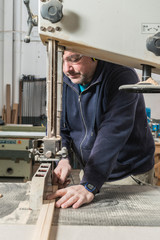 Male carpenter working in his carpentry workshop.