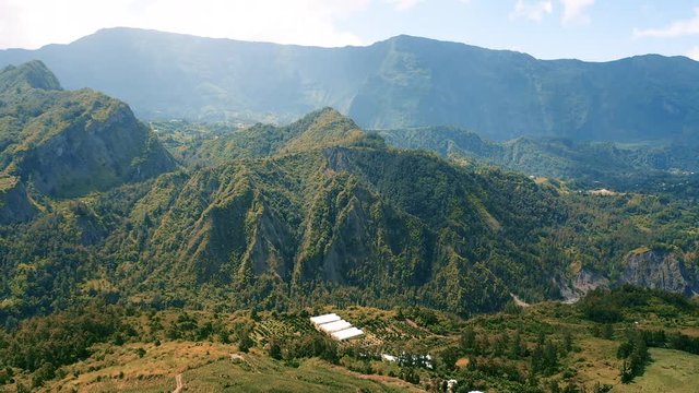 Aerial view over the dramatic mountain landscape surrounding the town of Hell-Bourg on Reunion Island