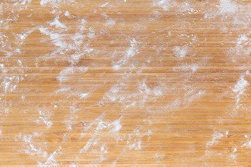 bamboo cutting board in flour © DimaCrow