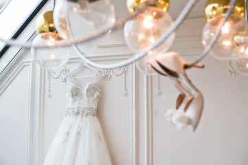 Luxury wedding lace dress in the classic interior of the hotel