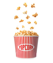 Carton bucket with delicious fresh popcorn on white background
