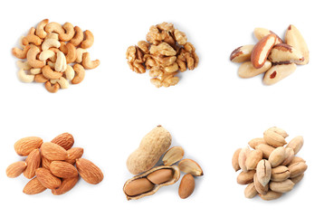 Set of different delicious organic nuts on white background, top view