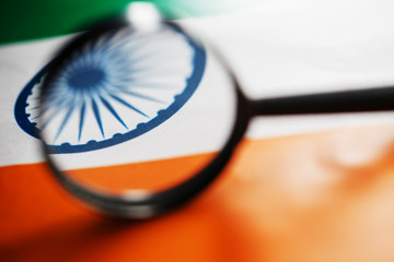 The Indian flag is visible through a magnifying glass. Spies and Observations for India India....