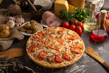 Pizza with ham and mushrooms for a restaurant menu.