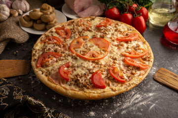 Pizza with ham and mushrooms for a restaurant menu.