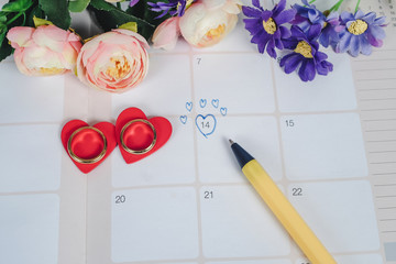 Word Wedding to Reminder Wedding day with Wedding ring on calendar planning and office tool.