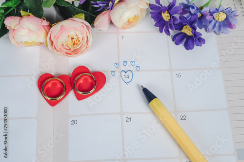 Word Wedding to Reminder Wedding day with Wedding ring on calendar planning and office tool.