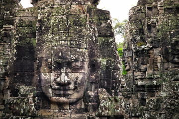 Smiling Faces of Bayon temple in Angkor Thom ancient ruin near Angkor Wat, Siem Reap, Cambodia...