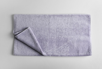 Fresh fluffy towel on grey background, top view. Mockup for design