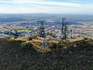 Aerial view of telecommunication antennas on the top of Black Mountain in Carmel Valley, SD, California, USA.  Television, radio and communications antenna with numerous transmitters, Technology.